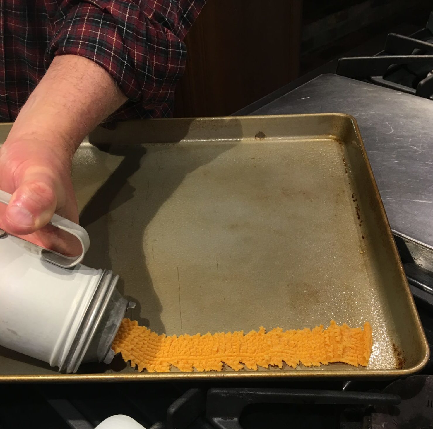 Cheese crackers being made with old cookie press