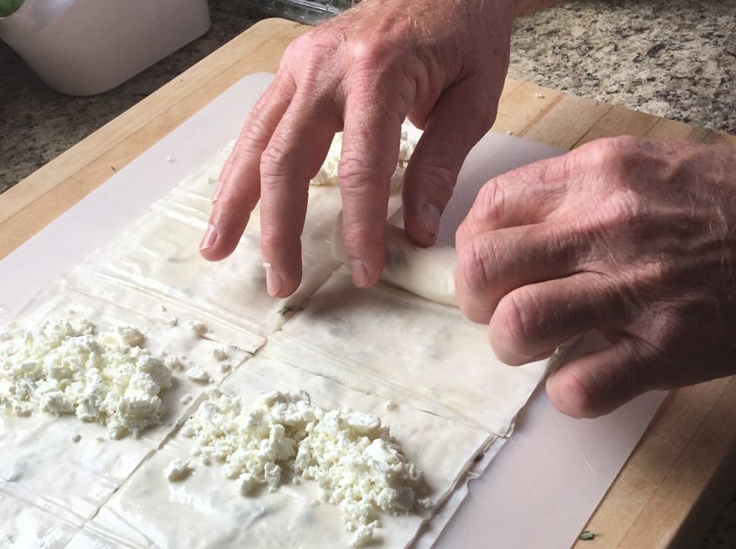 Rolling goat cheese into Filo dough