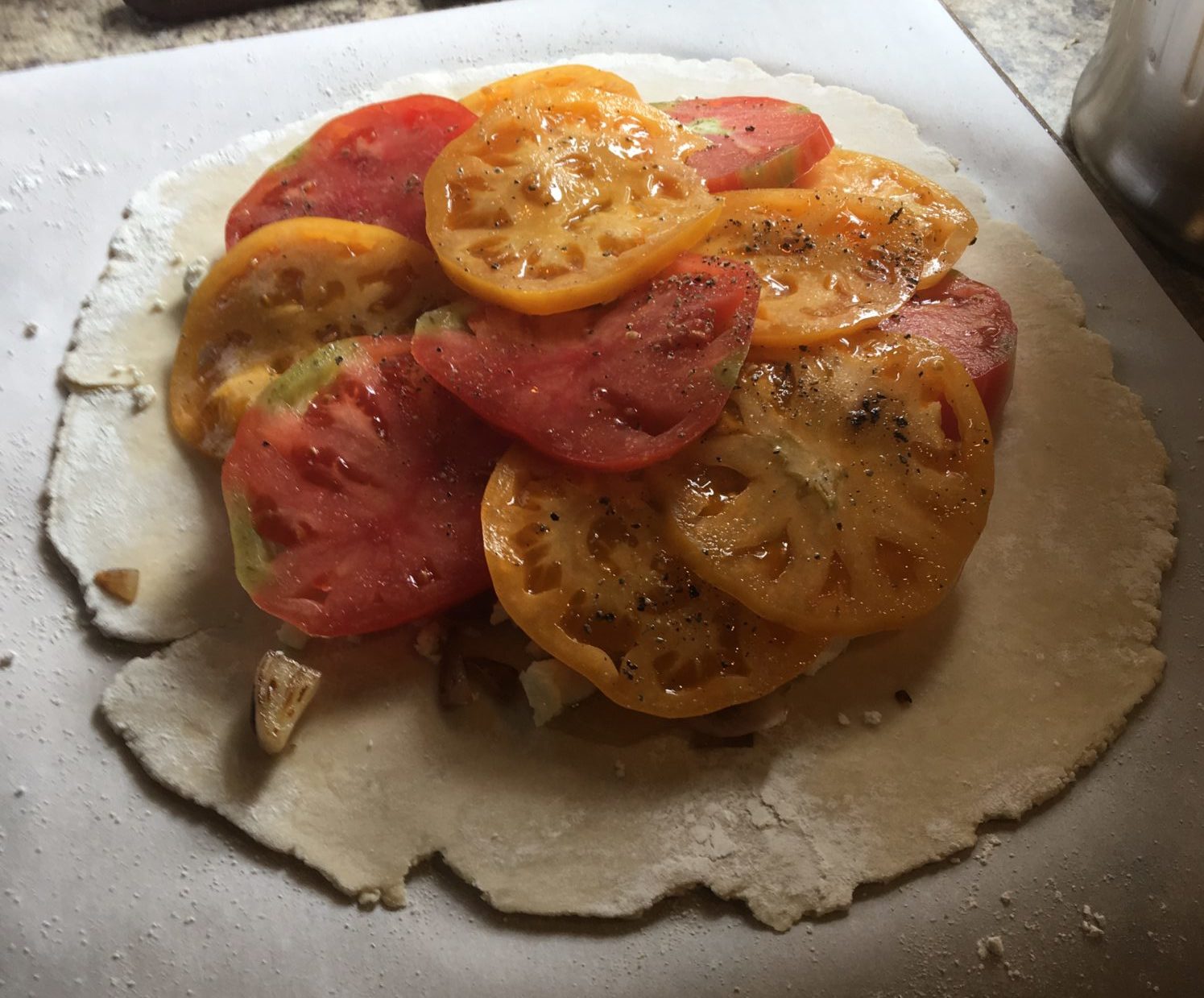 red and yellow tomato slices on a pastry