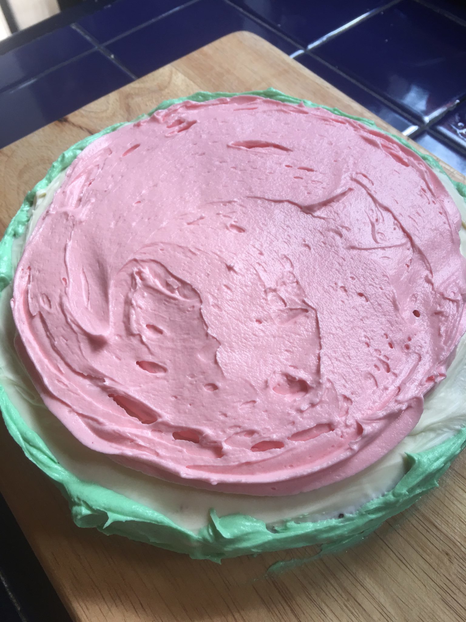 Assembling a watermelon cake