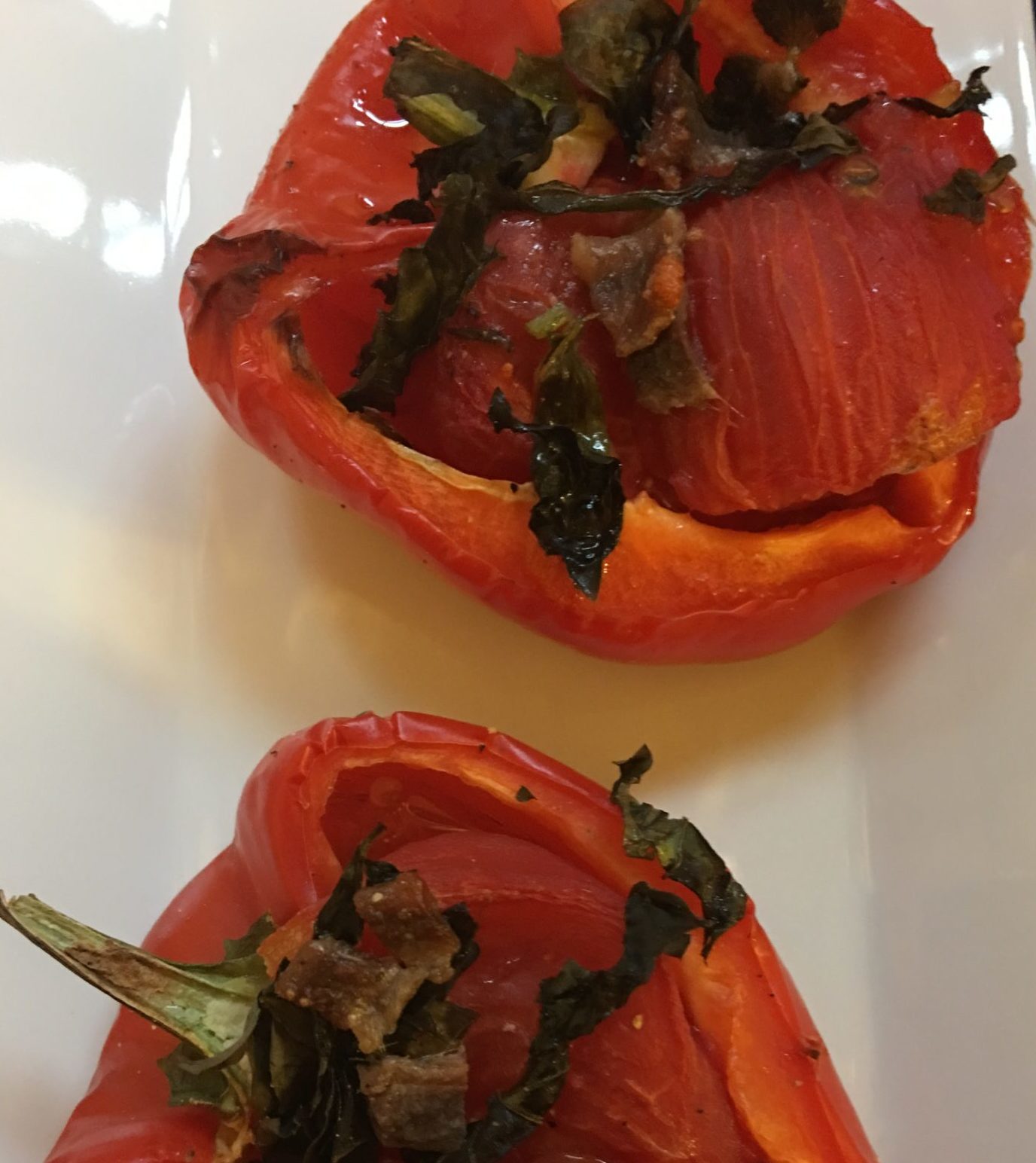 Tomatoes in roasted red peppers with basil and anchovies