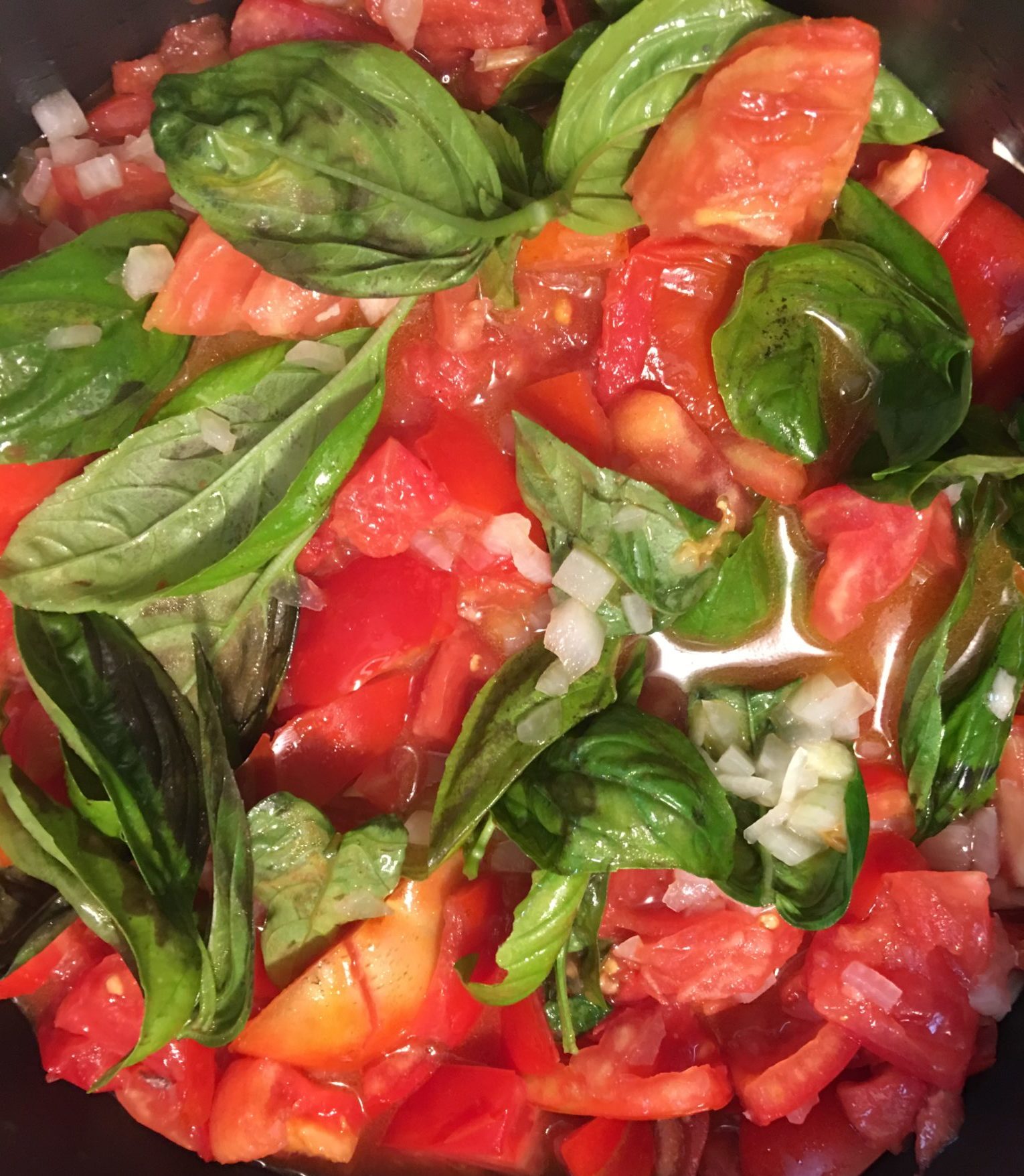 Basil and tomatoes in a pot