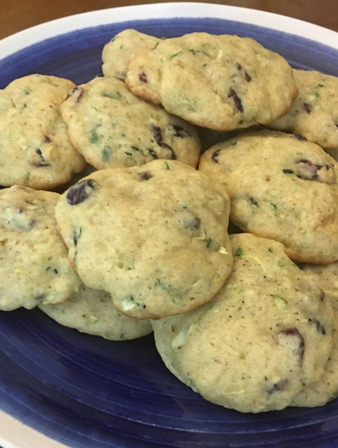 Zucchini and Cranberry cookies on a white rimmed blue plate