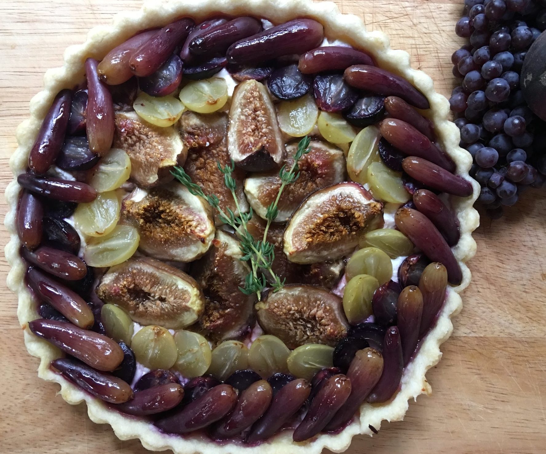 Grape and fig tart with honey, thyme and goat cheese