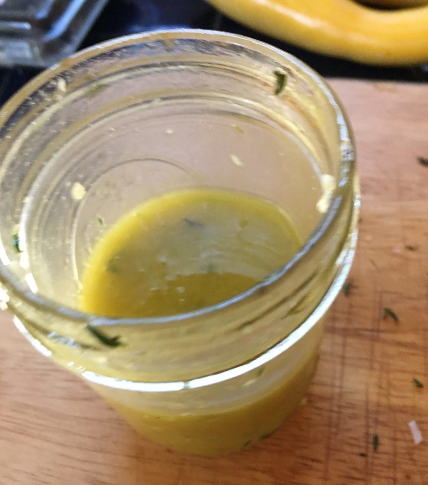 Mason jar of honey thyme salad dressing