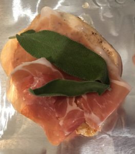 Prosciutto and sage leaves on chicken breasts