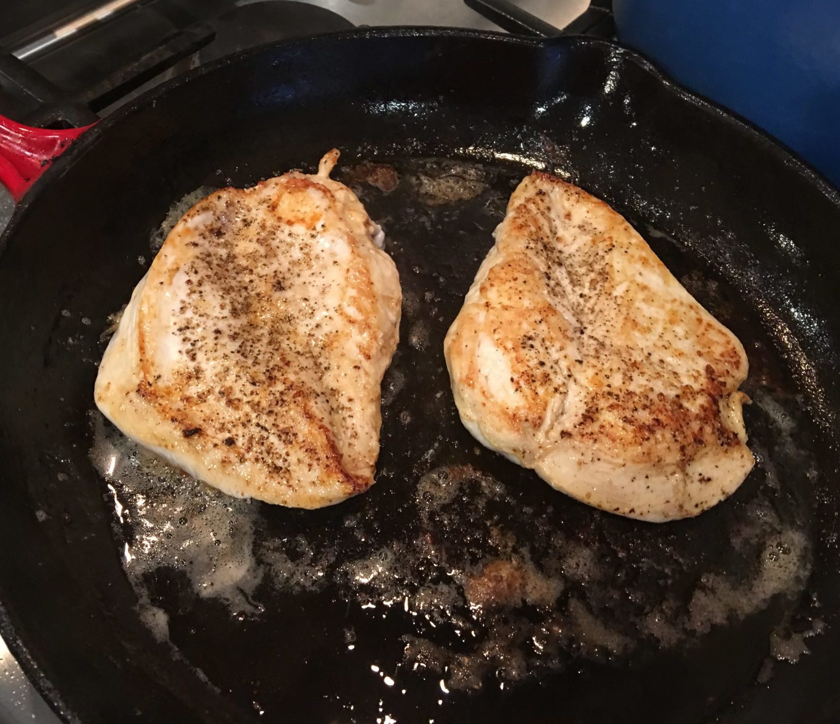 Chicken breasts browned in a pan