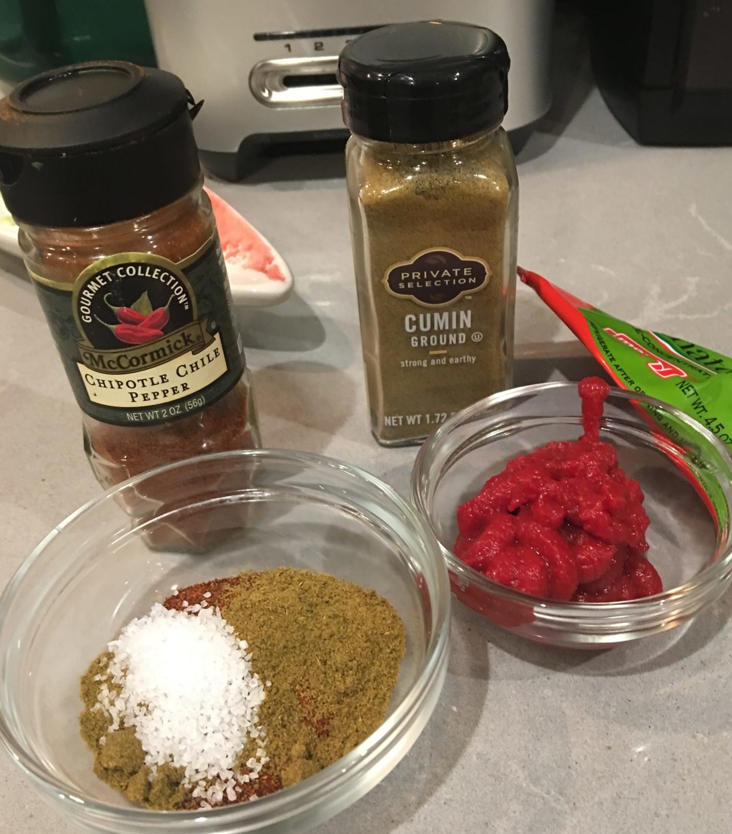 Chili powder, cumin and tomato paste