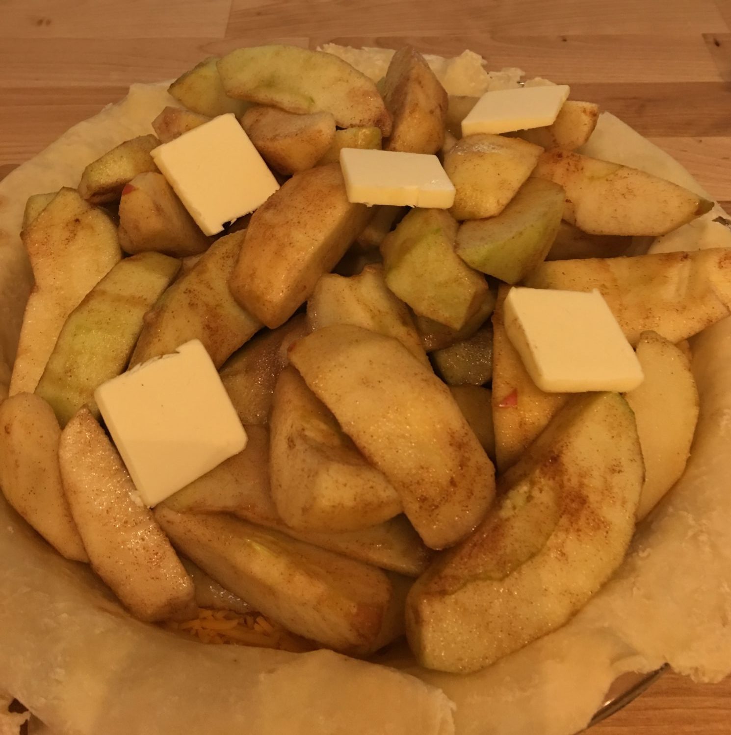Apples in pie crust before baking