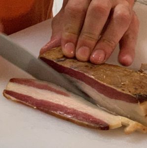 Slicing Sugar Creek Meats Bacon