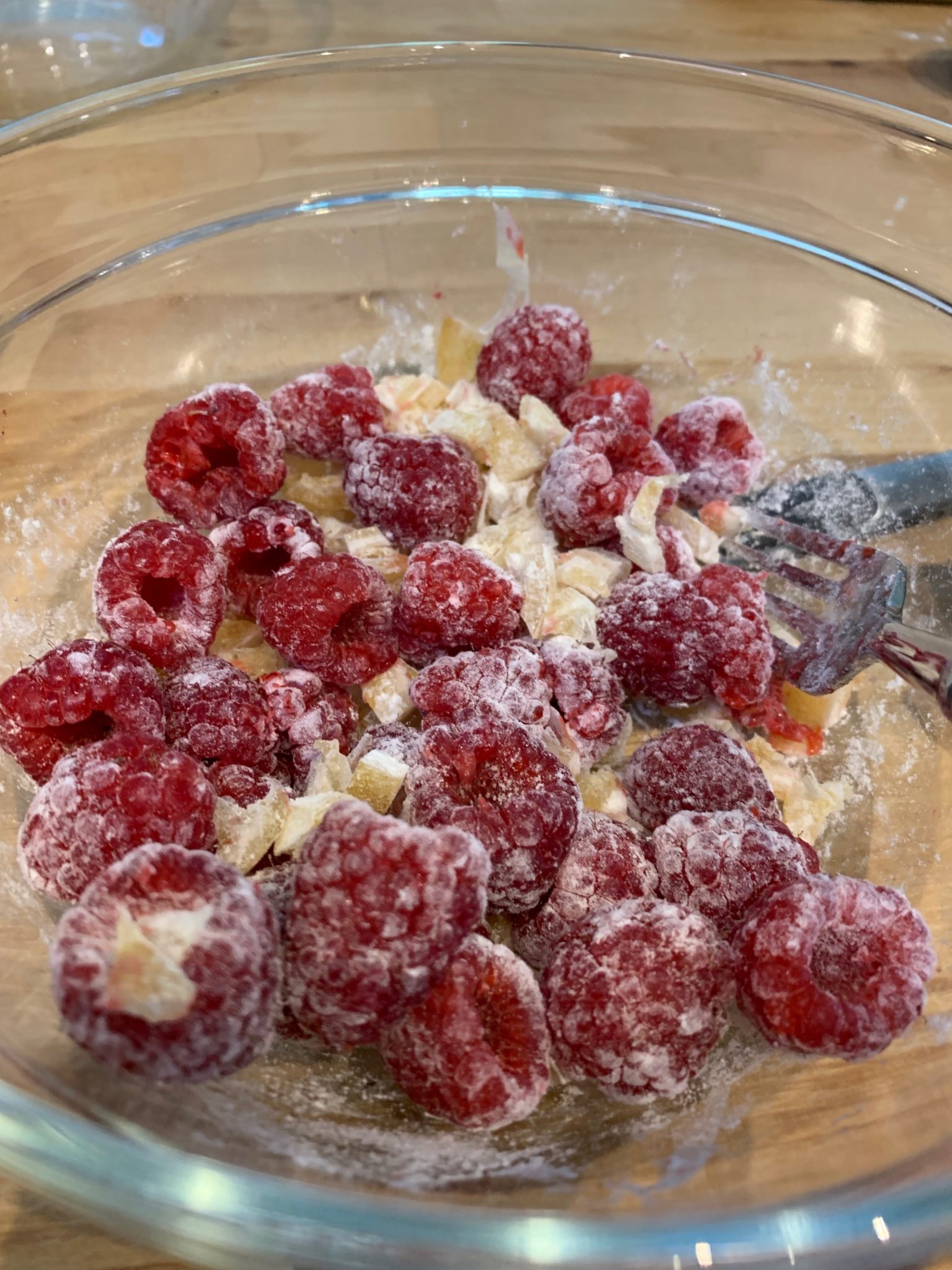Flour coated lemon dice and raspberries