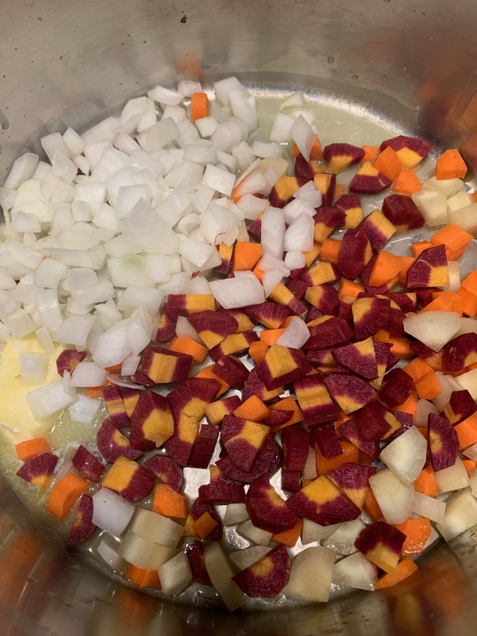Showing carrots and onion cut to a similar size for cooking