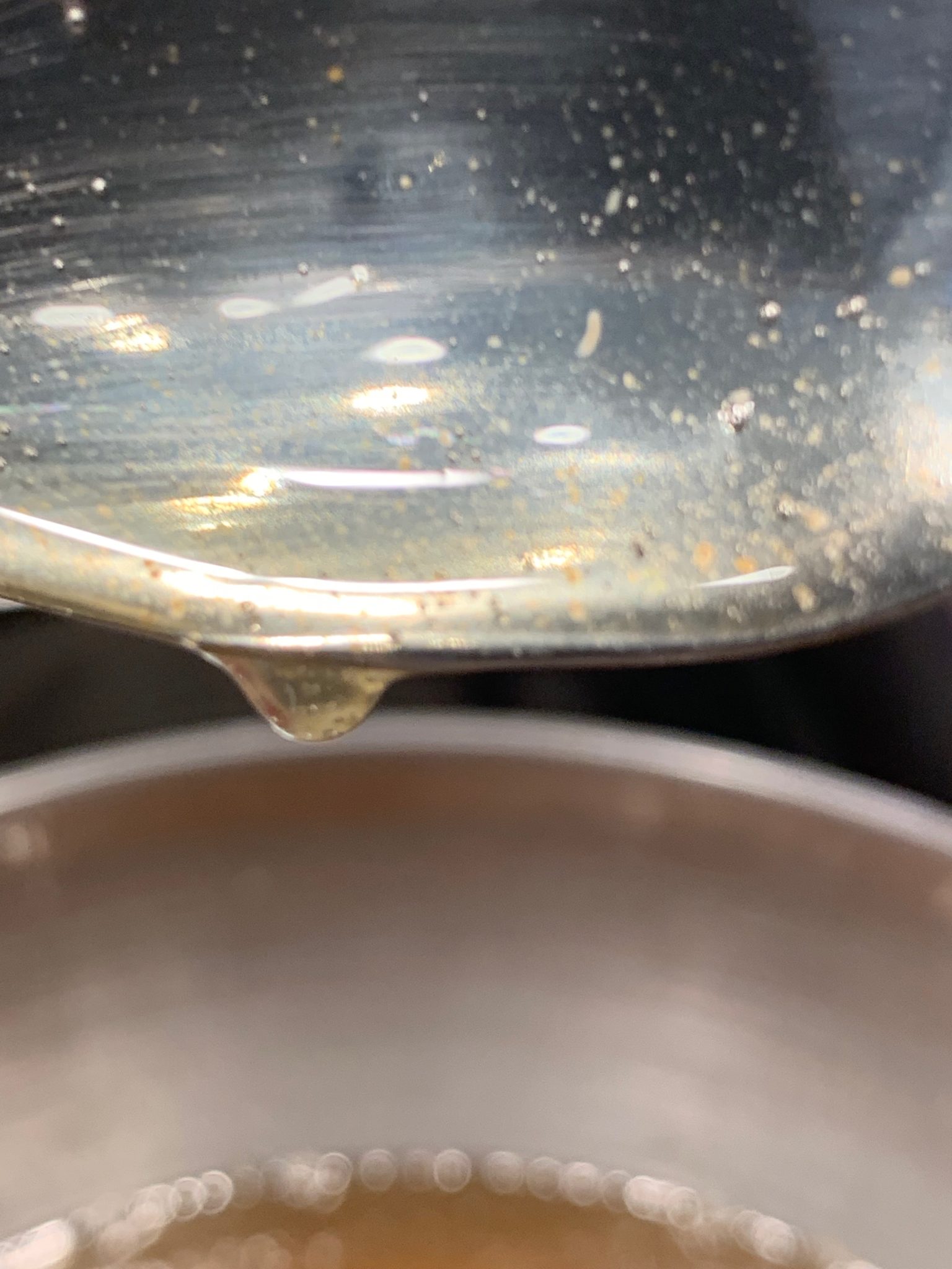 Sugar syrup boiled until thick will fall off the spoon in a sheet