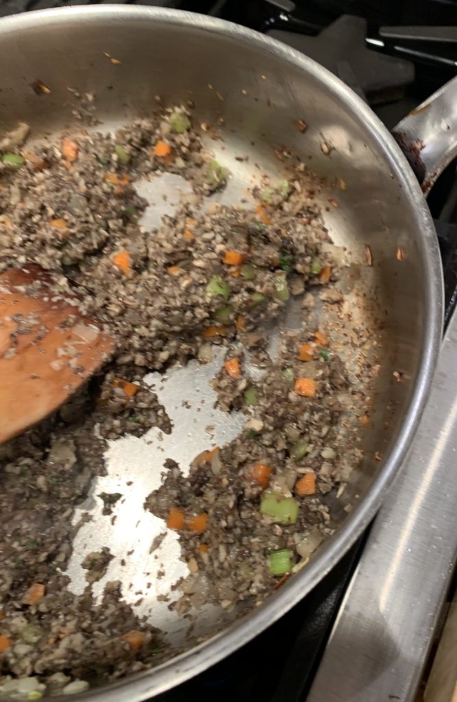 Wild mushrooms browning in a pan