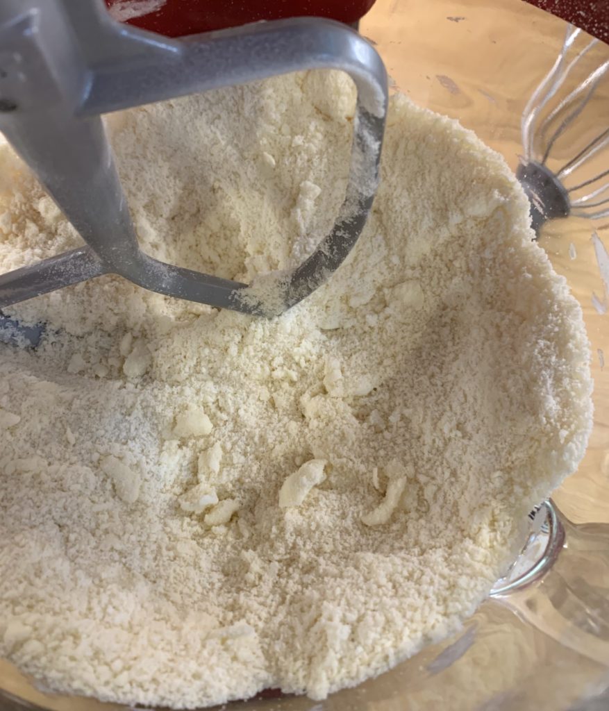 Butter cut into flour until it resembles sand