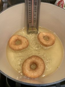 Golden brown donuts in oil