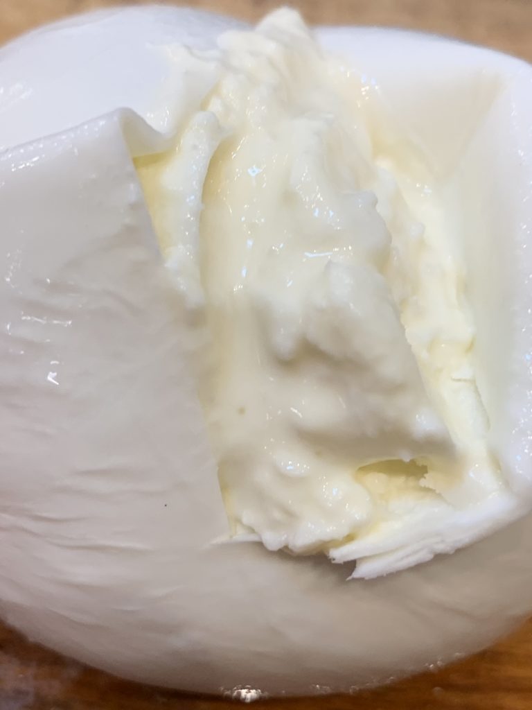 The creamy interior of burrata cheese