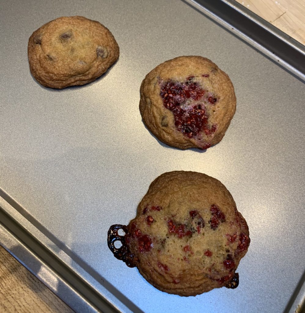 Three different chocolate chip cookies with jam