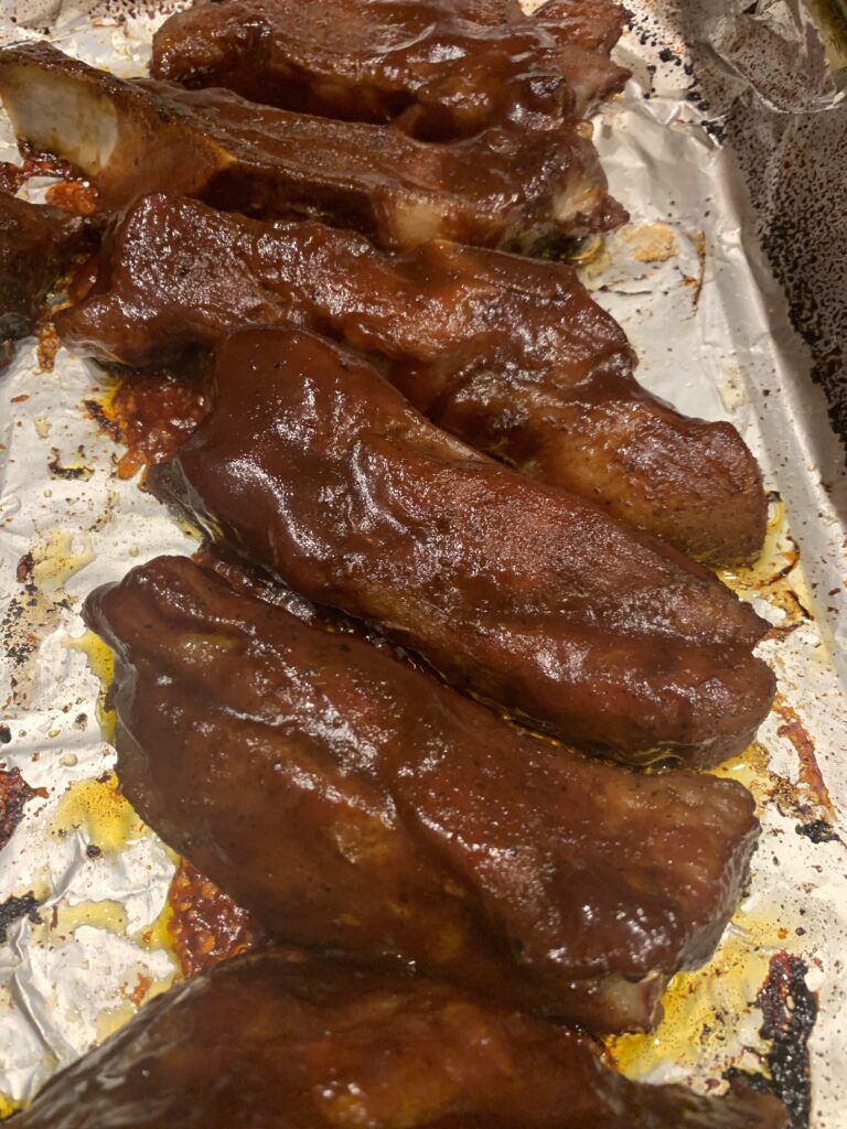 Ribs covered with BBQ sauce