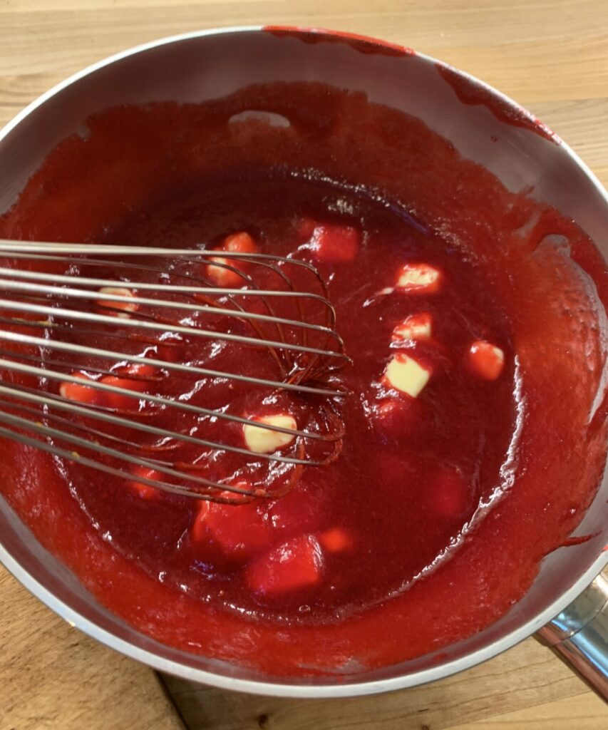 Butter is stirred into Cranberry puree