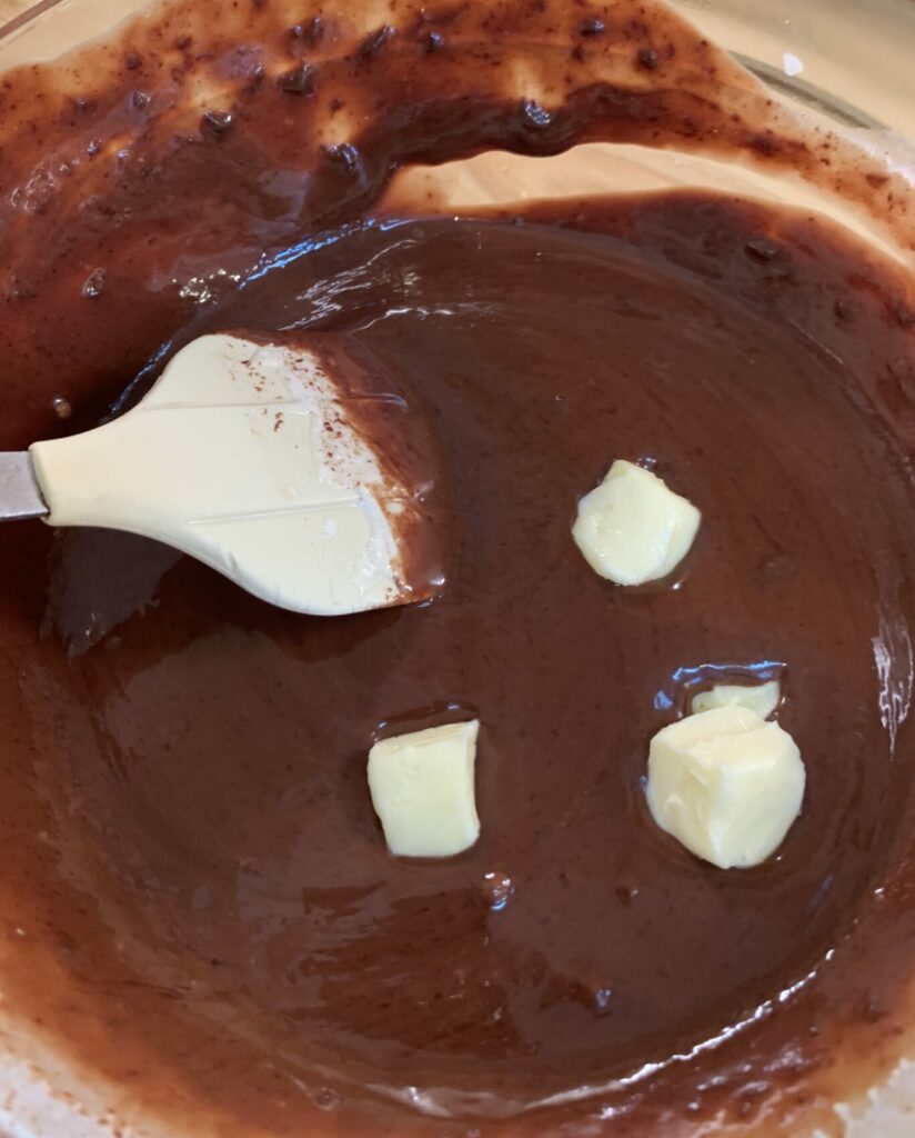 Stirring butter into chocolate ganache