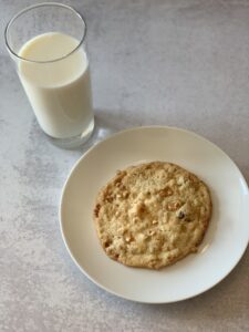 A cookie and a glass of milk