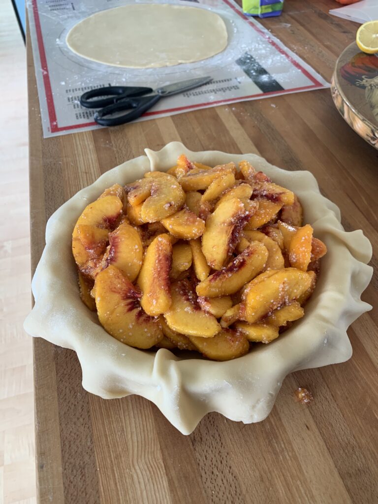 The insides of a peach pie