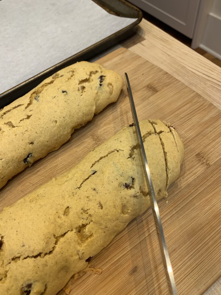 Slicing biscotti into cookies