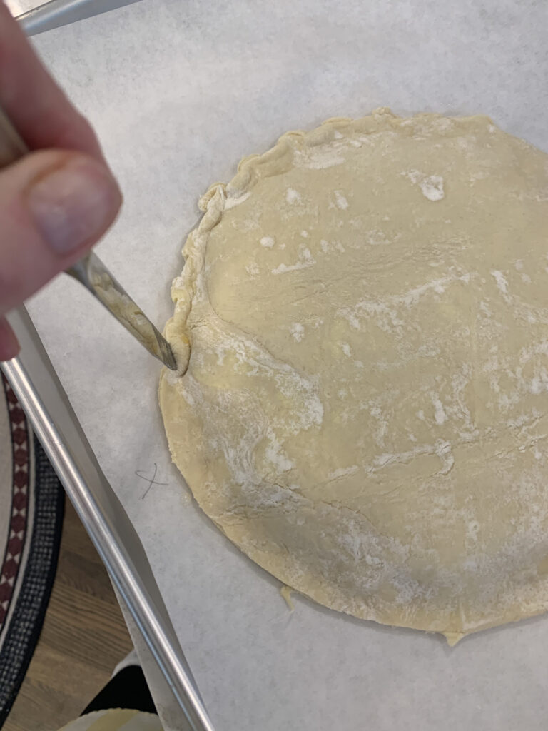 Use the back of a knife to push the side in towards the center of the cake every half inch or so