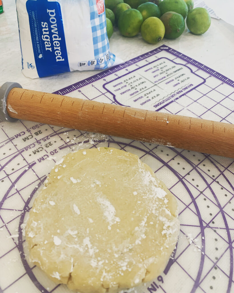 rolling dough with powdered sugar